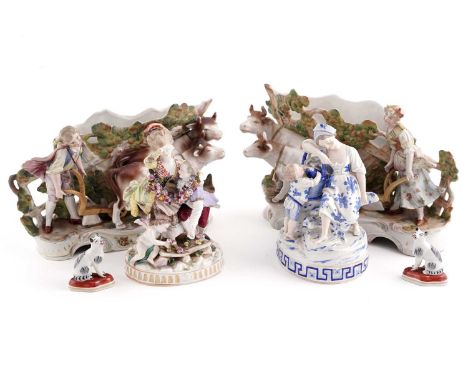 A collection of continental ceramics, comprising: a pair of early 20th Century continental porcelain figural vases, modelled 
