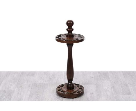 A Victorian style mahogany snooker cue stand, with turned column on circular base, 75cms high.