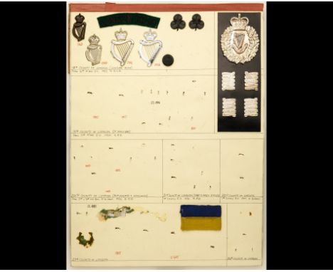 Insignia of London Territorial Battalions  A depleted card retaining some items of the London Irish Rifles,  including KC and