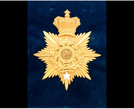 An officer's Albert shako-plate of the Cameronians.  A rare example. The gilt star inscribed 'Corunna' and 'Egypt' on the hor