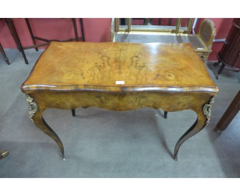 A Victorian figured walnut and ormolu mounted card table