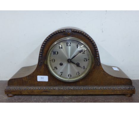 An oak mantel clock 