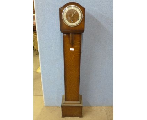 An oak dwarf longcase clock