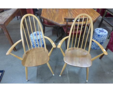 A pair of Ercol elbow chairs