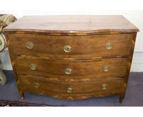 COMMODE, mid 18th century Italian walnut, olivewood and line inlaid with a serpentine shaped top and three long drawers below