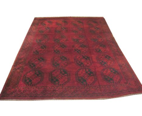 VINTAGE AFGHAN CARPET, 354cm x 274cm, repeat tribal guls on a bordeaux field within a corresponding border.