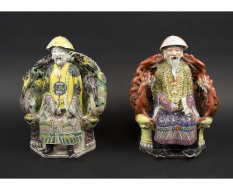 SEATED CHINESE FIGURES, two similar, Oriental ceramic decorated in colours, 22cm H. (2) (with faults)