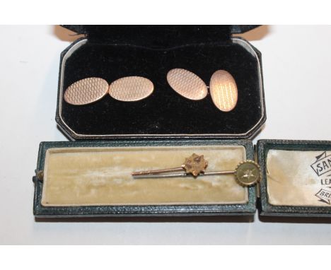 A pair of 9ct gold cuff-links, 2.5gms; a diamond set stick pin and a stick pin with 9ct gold head
