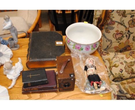 A leather and brass bound Bible; a Box Brownie camera; a German porcelain headed doll AF
