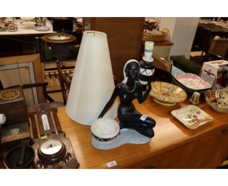A plaster figural decorated table lamp and shade 