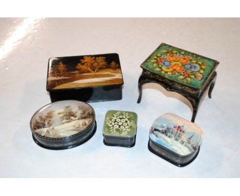 A Russian papier mâché Palekh ware trinket box in the form of a table and four other similar boxes 