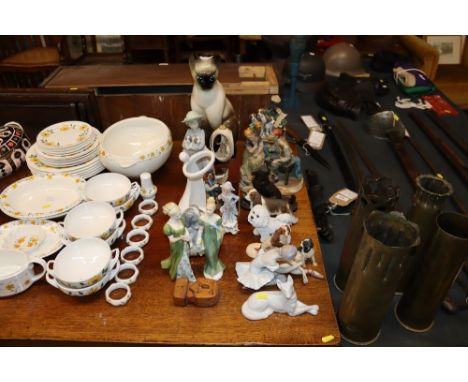 A collection of various ornaments and figures to include Royal Doulton, Lladro, NAO model Siamese cat
