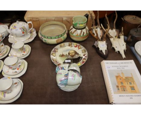 An Art Deco style pottery floral decorated bowl marked to base BASRA; a similar style jug; a Royal Doulton "Shakespeare" plat