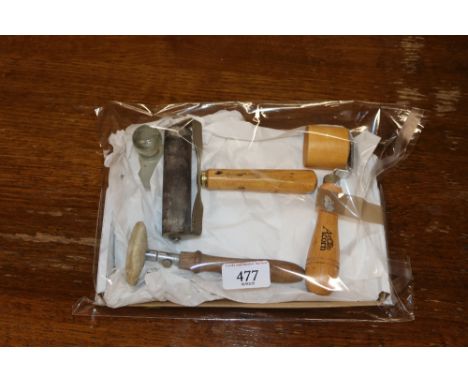 A glass Muller artists tool; ink roller with wooden handle stamped LCC; an Acorn wooden handled roller blotter; felt blotter 