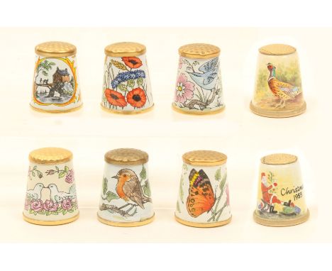 Eight modern enamel thimbles, comprising; Christmas 1983 example, another with a pheasant, both by Graham Payne Studios, 1983