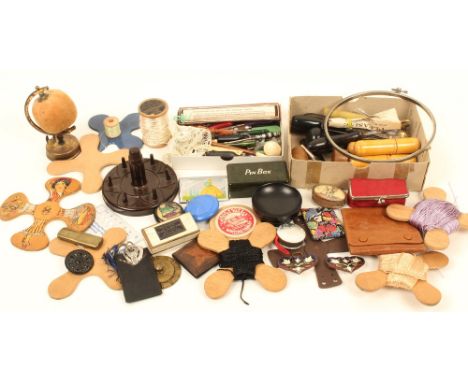 A mixed lot, including; large wooden winders, one transfer decorated with a female figure, 14cm, a Bakelite reel and thimble 
