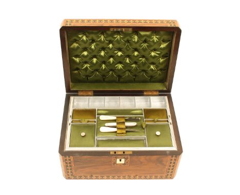 A mid-Victorian rectangular sewing box, the figured walnut ground with geometric inlaid borders to the front and lid with mot