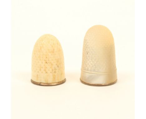 Two thimbles, 19th century, comprising; a mother of pearl example with plain frieze and copper gilt rim, and a similar bone e