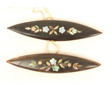 A pair of horn, abalone, pearl and wire inlaid tatting shuttles, with variant floral patterns, bone dividers, one slight nick