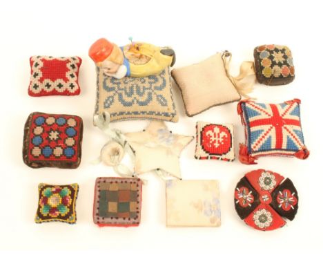 A collection of pincushions and other pieces, formerly in the collection of Robert Warner, comprising; six square or rectangu