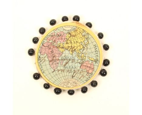 A paper colour printed disc form pin wheel in the form of a globe form map, one side inscribed in ink "To Annie Wishing You a