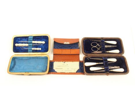 Four late 19th century leather cased sewing companions of purse or wallet form, comprising; a brass frame example with 'knott