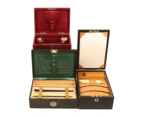 Three late Victorian leather covered rectangular sewing boxes, comprising; a black leather combination sewing/writing box, bu