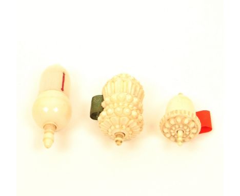 Three good 19th century ivory tape measures, all of acorn form, with spindle winders, comprising; a carved and engine turned 