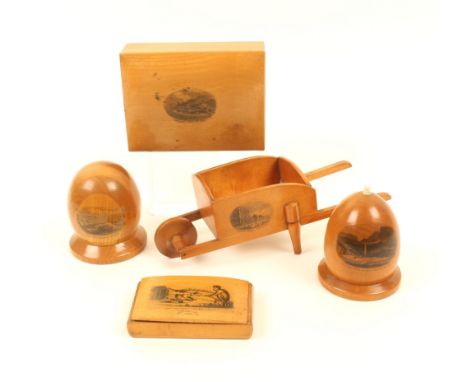 Four pieces of Mauchline ware, comprising; a wheelbarrow (View From the Jetty, Yarmouth/Marine Parade …), 19cm, a skep form g