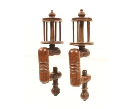 A good pair of rosewood winding clamps, the ring turned rectangular frames with roundel turned screws below tapering reel top