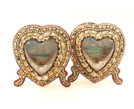 A pair of Victorian heart shaped shellwork frames, each with a central heart shaped glazed insert incorporating a colour prin