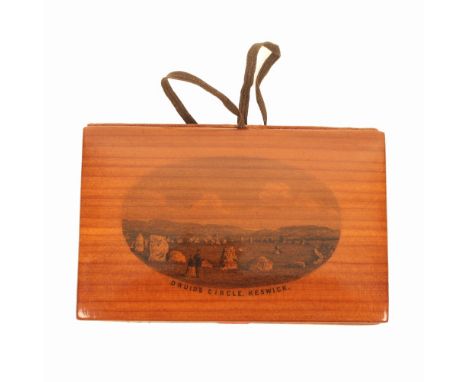 A Mauchline ware needlebook/sewing companion, cedar wood (Druids Circle, Keswick), the red cloth interior near mint with flan