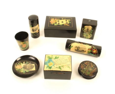 Eight pieces of black ground Mauchline ware, comprising; a playing card box (five of clubs/flowers), 11.5cm, a money box (Thr