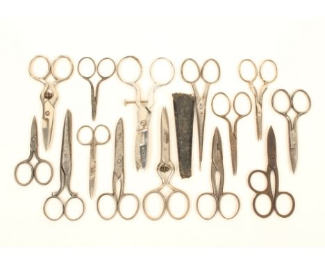 Fourteen pairs of steel scissors, suitable for sewing boxes, including button holing examples, largest 12.5cm.  (14)