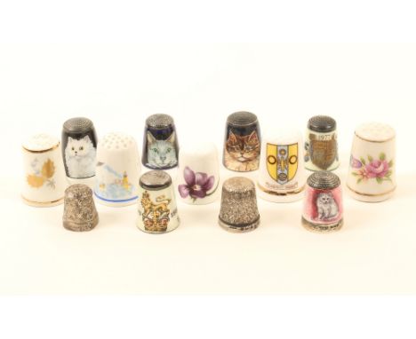 Thirteen various thimbles, comprising; six enamel and silver examples, by James Swann and Son, comprising four, each decorate