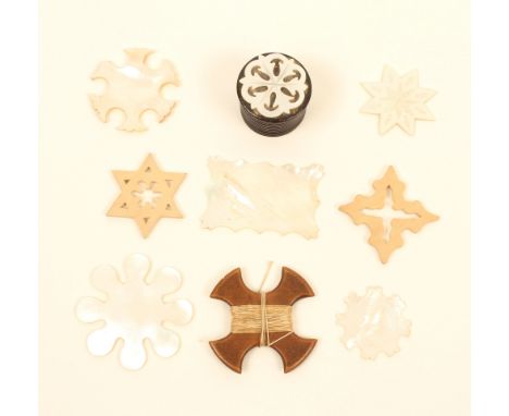 Eight silk winders and a related box, comprising; five mother of pearl examples in various forms, two with engraved decoratio