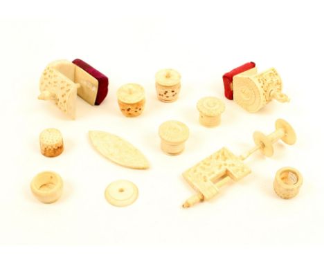 A collection of Cantonese ivory and bone sewing tools, mostly carved, comprising; three clamps, largest 10.6cm, a shuttle, 6c