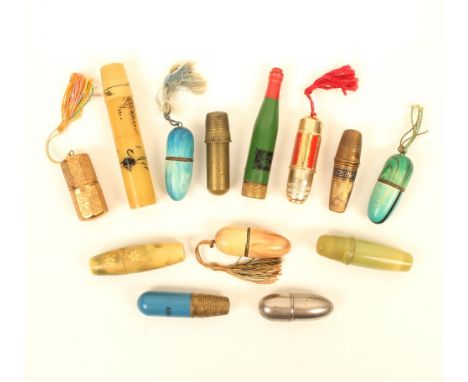 Thirteen thimble companions, including; a French painted metal example, labelled "Scotch Whisky", with internal reel and need