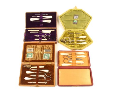 Four late 19th/early 20th century sewing companions, comprising;  a rectangular form leather example with seven tools and acc