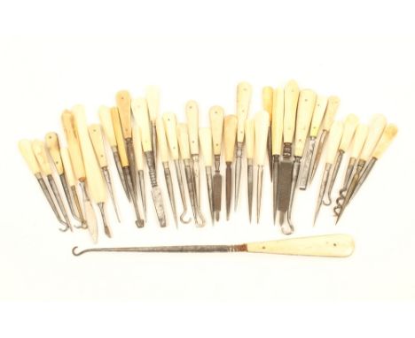 Thirty five sewing and other tools, suitable for sewing boxes, all with plain bone handles, including stilettoes, button hook