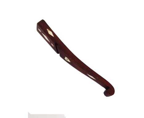 A 19th century mahogany knitting stick of curved form, with scroll end inlaid with bone diamond motifs and a heart initialled