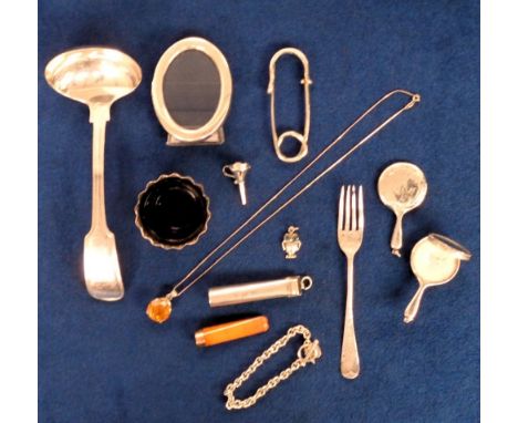 Silver, 12 items of silver to comprise a miniature compact, a gold tipped cigarette holder in silver case, a handmade kilt pi
