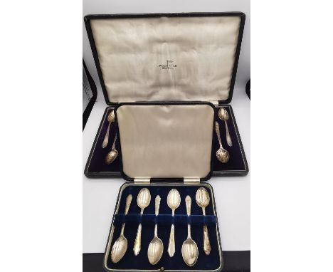 Two cased sets of engraved silver coffee spoons. A Mappin &amp; Webb cased set of twelve coffee spoons and sugar tongs along 