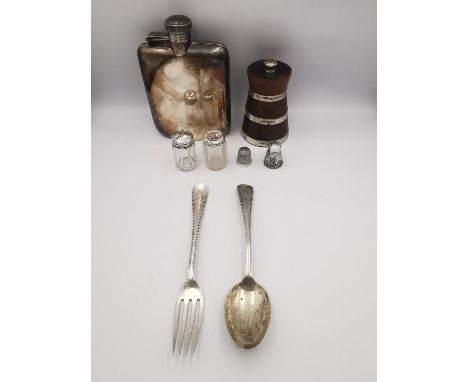 A Swaine and Adeney white metal (tests as silver) four ounce lockable hip flask along with two silver thimbles, a fork and sp