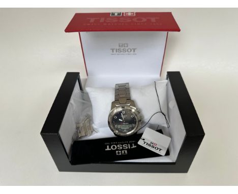 A boxed mens Tissot T-Touch II Expert T047420A smart watch with carbon fibre touch screen, titanium dial and articulated brac