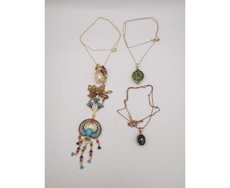 Four 20th century gold plated silver pendants and chains, a peridot and garnet cluster marquise pendant, a Egyptian scarab ne