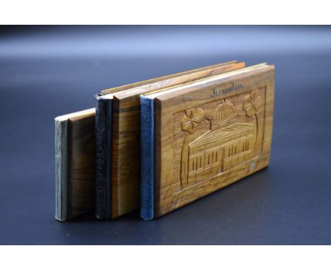 FLOWERS OF THE HOLY LAND:&nbsp;a group of 3 souvenir viewbooks of Jerusalem, each bound in olivewood and with tipped-in press
