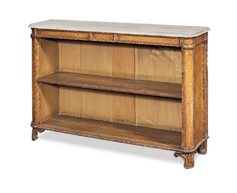 A George IV/William IV bird's-eye maple low open bookcase, circa 1820-30With shaped white marble top, a beaded and tablet cen