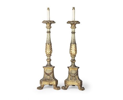 A pair of 18th century and later parcel-gilt and polychrome-painted floor-standing torcheres, converted to lamps, ItalianEach