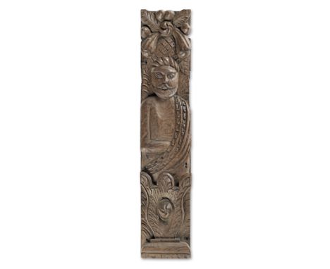 A James I/Charles I carved oak figural term, circa 1620-40Topped by a spray of tobacco leaves and a pineapple, the male figur